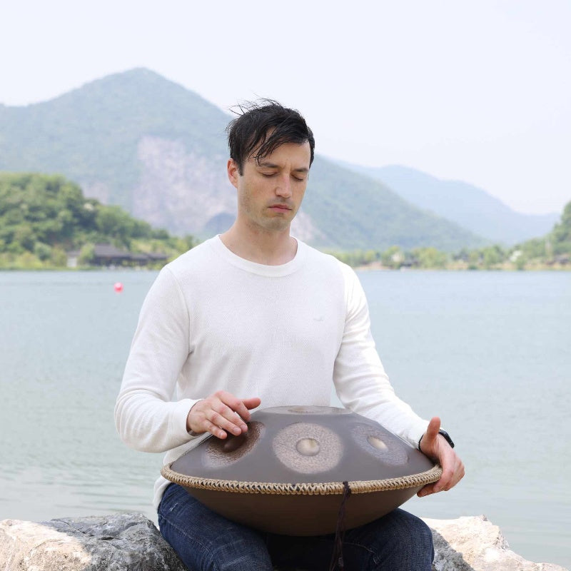 Meditative session enhanced by musicians playing handpan rhythms.