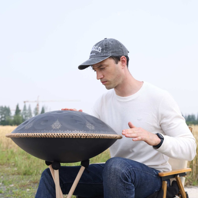 Handpan musicians performing tranquil tunes for meditation.