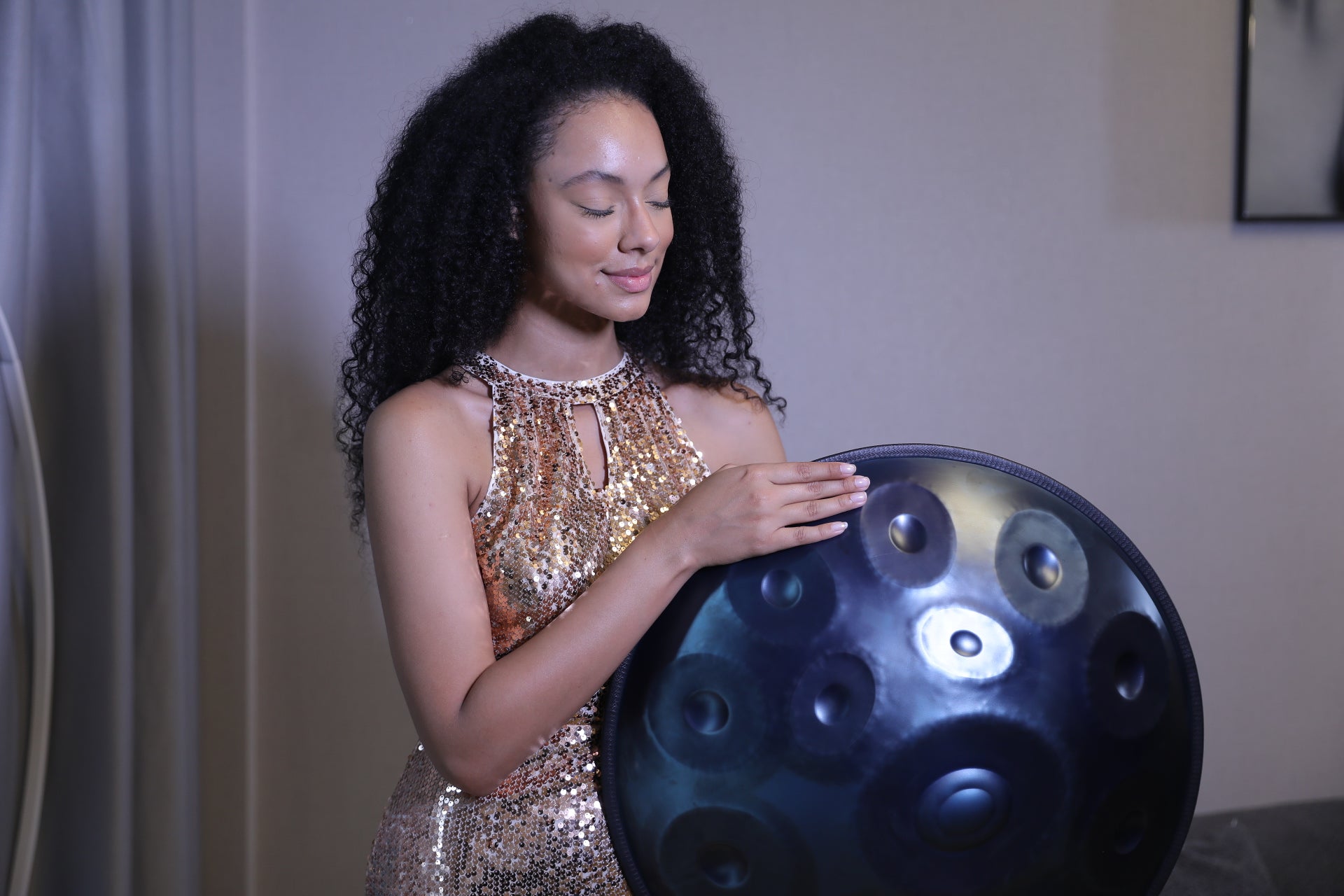 The beautiful model who is showing handpan