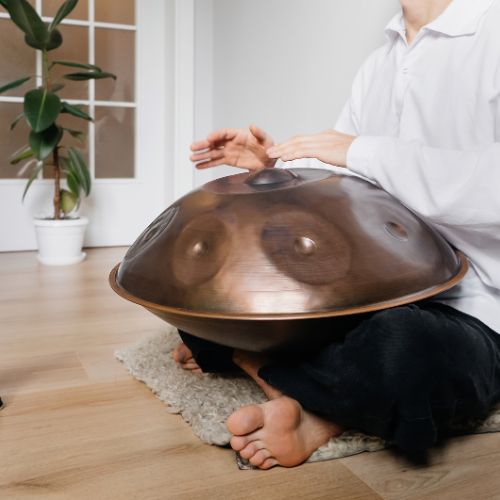 Artists practicing handpan indoors