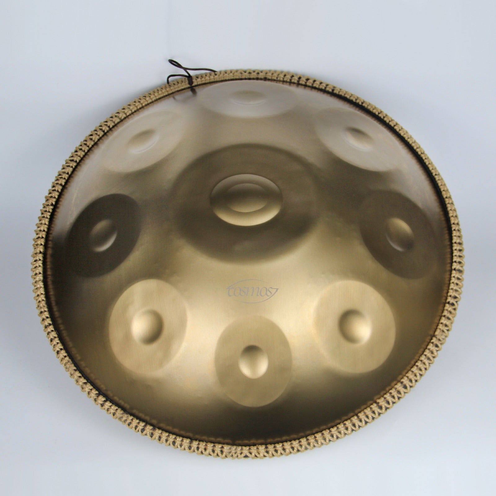 Close-up of a shimmering Golden handpan drum