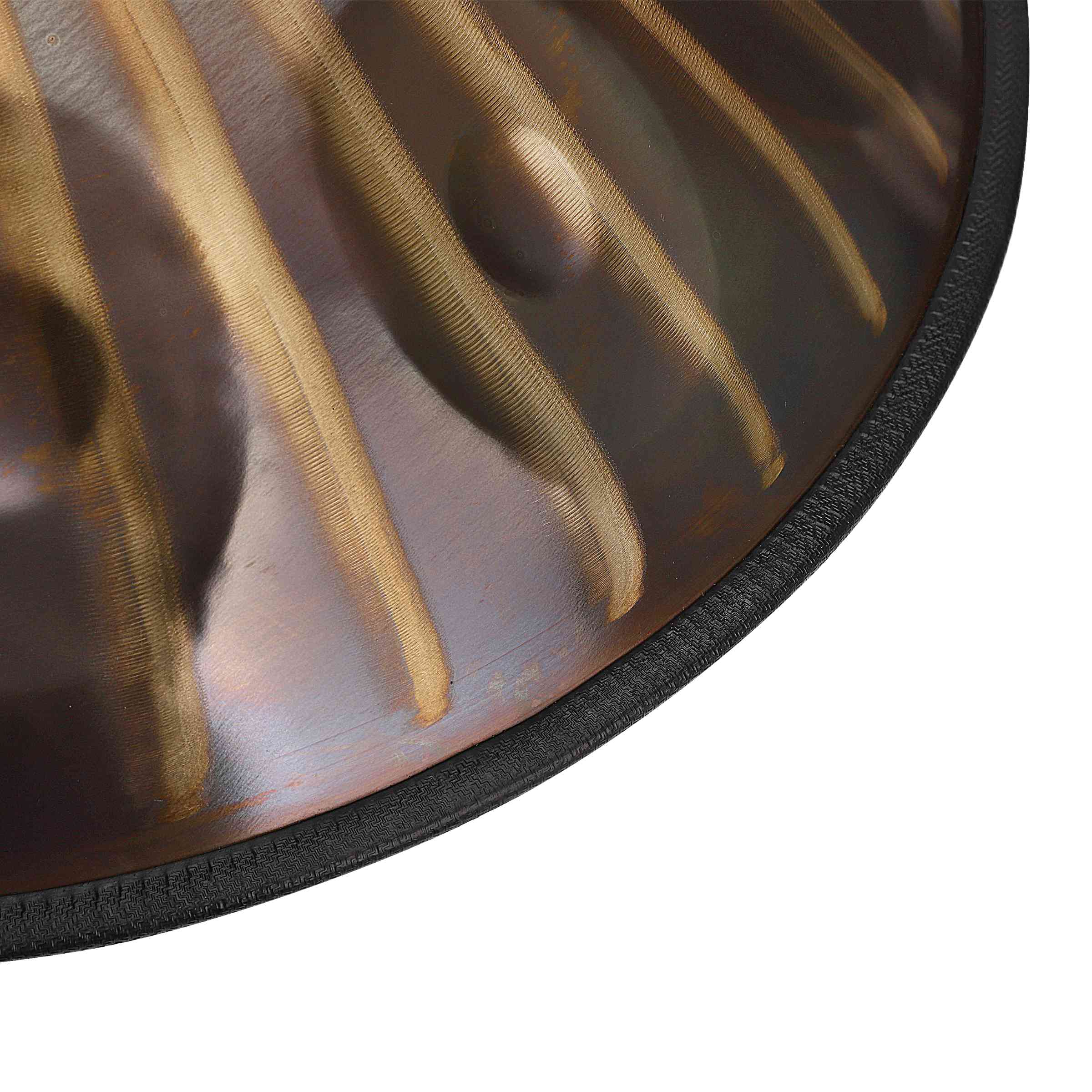 Close-up of a shimmering Gold handpan drum with sun totem designs