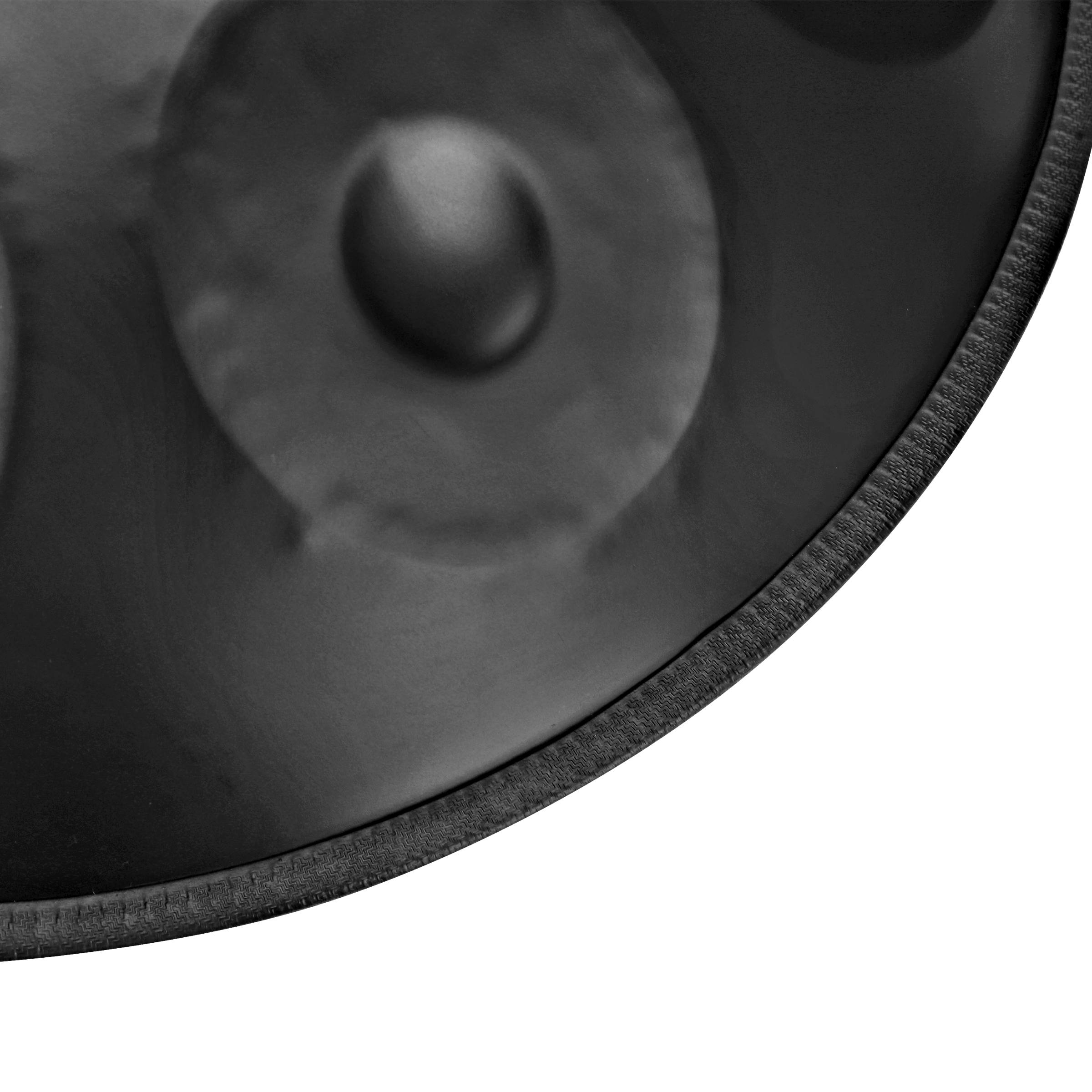 Close-up of black handpan drum surface