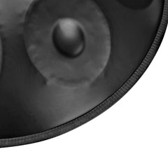 Close-up of black handpan drum surface