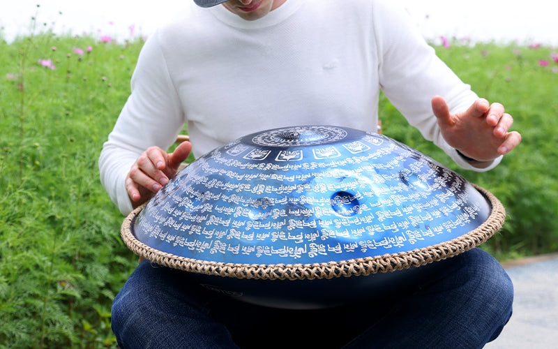 Artists playing handpan in an outdoor park